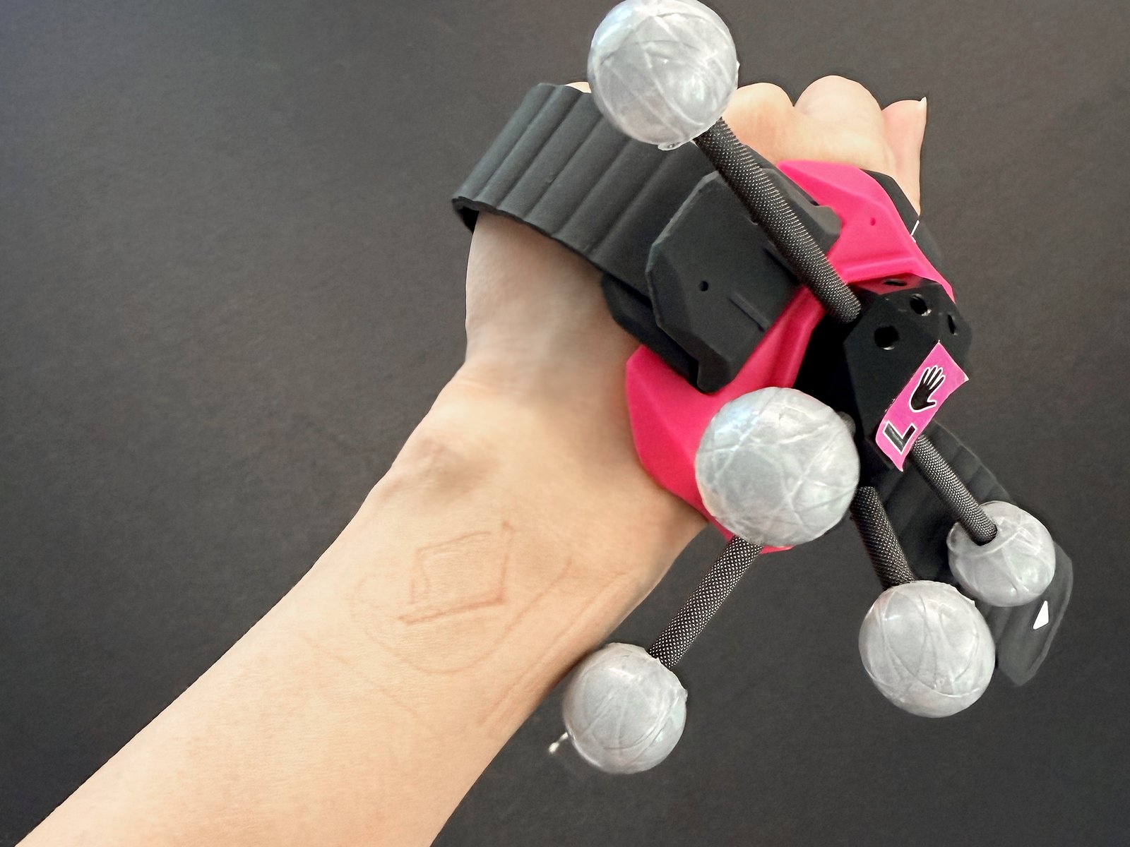Sandbox VR logo imprinted on a player's wrist after removing the tracker