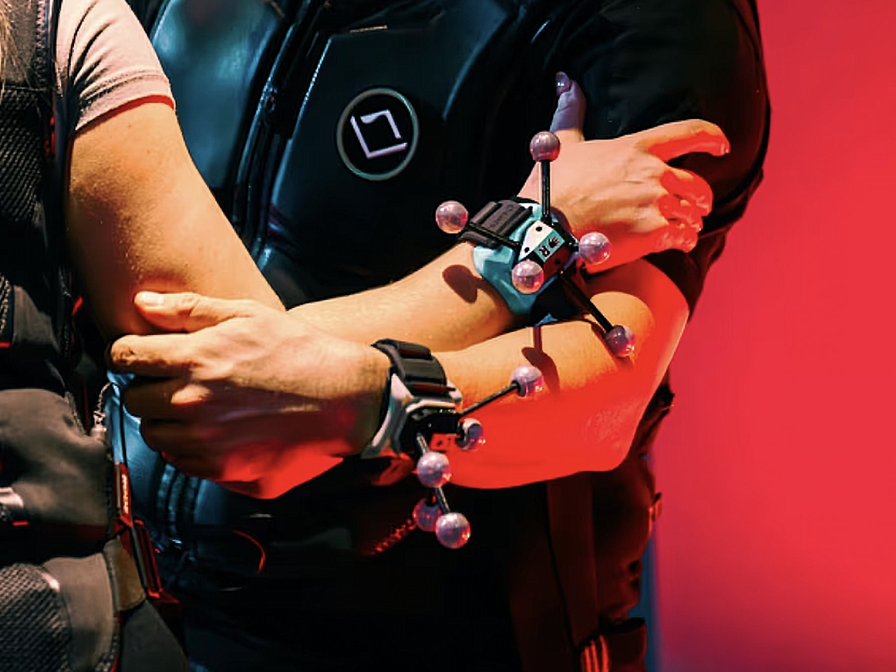 Player wearing wrist trackers under arena lighting