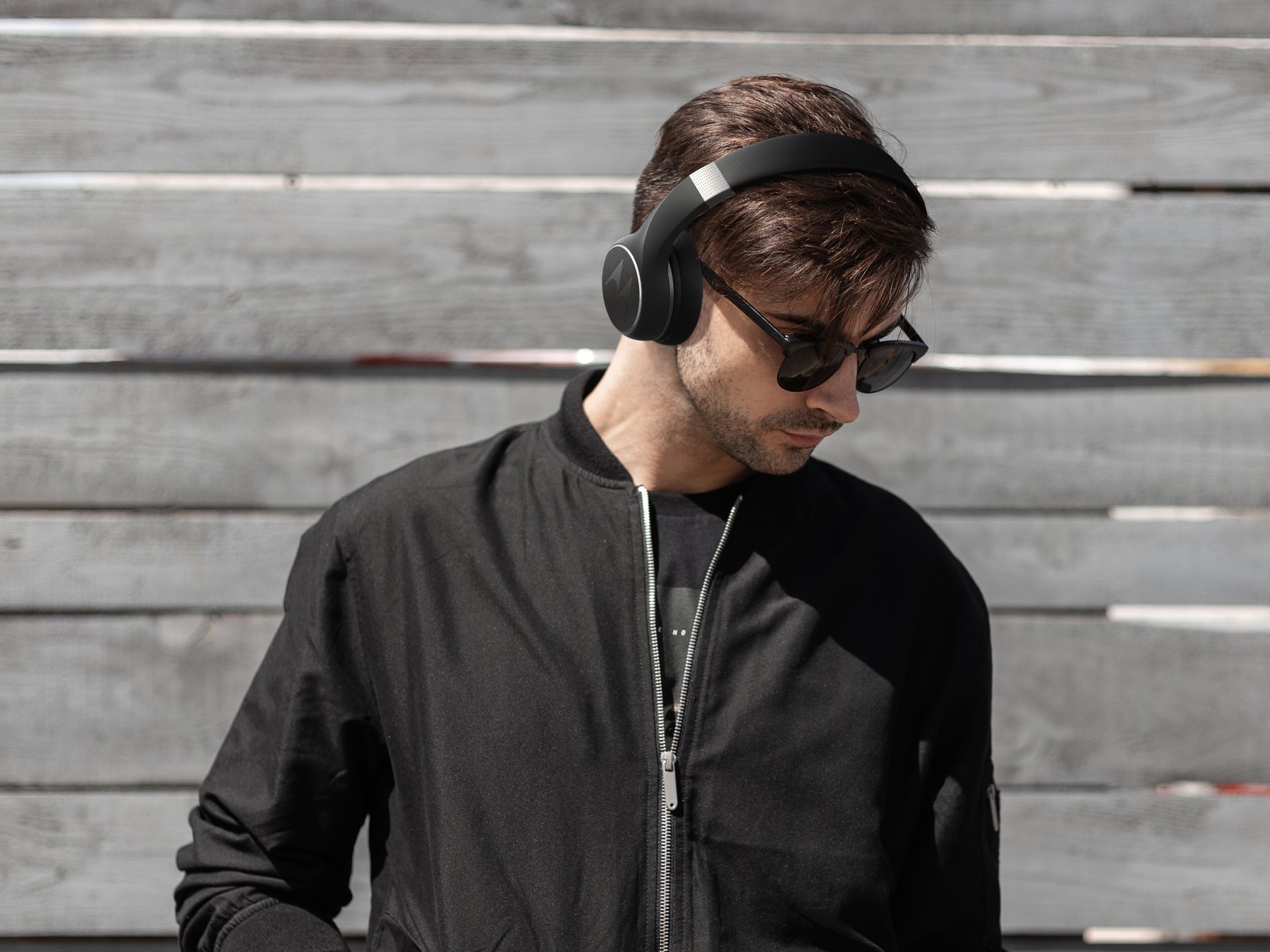 Person wearing black Motorola headphones