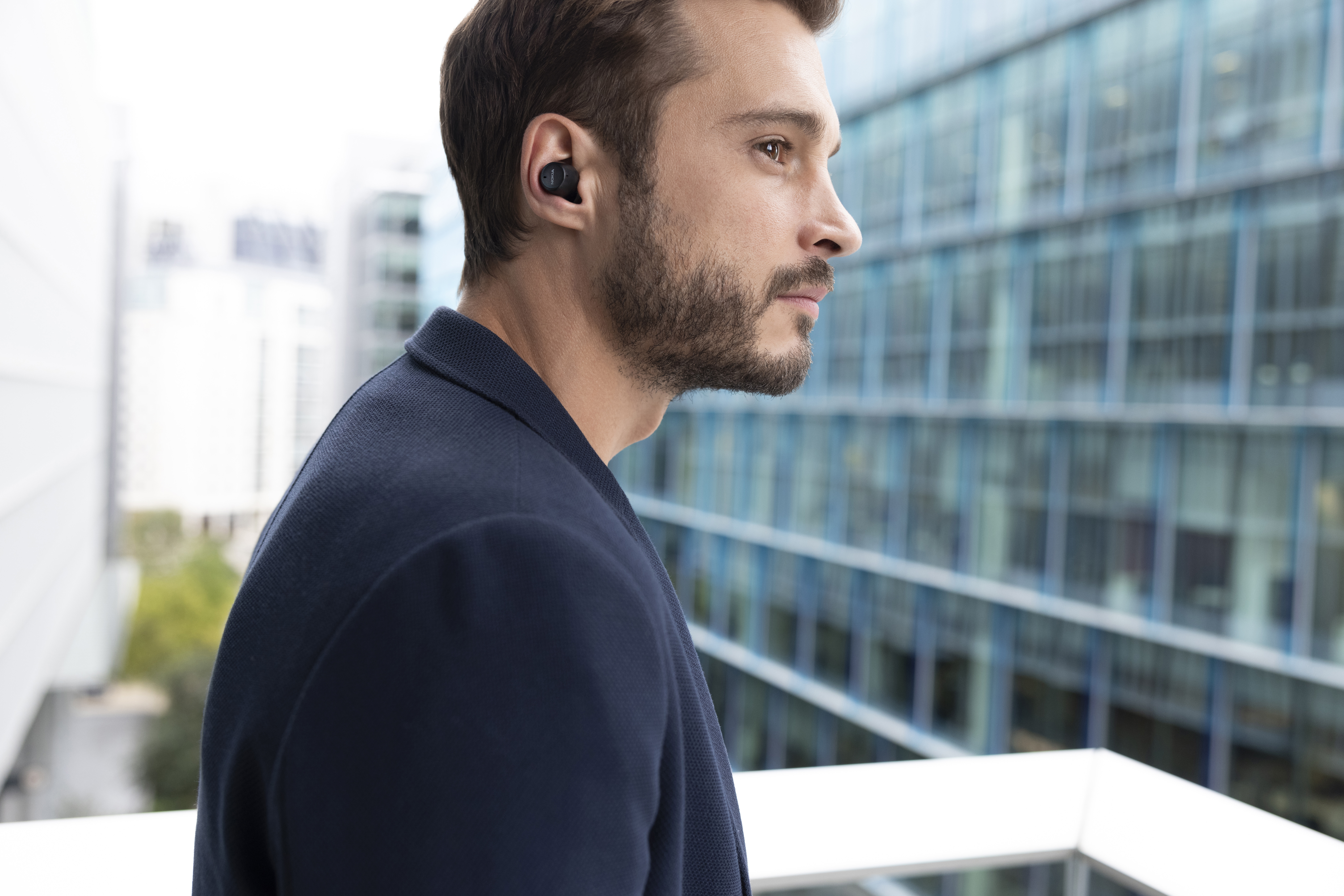 Runner wearing blue Nokia Micro Earbuds Pro