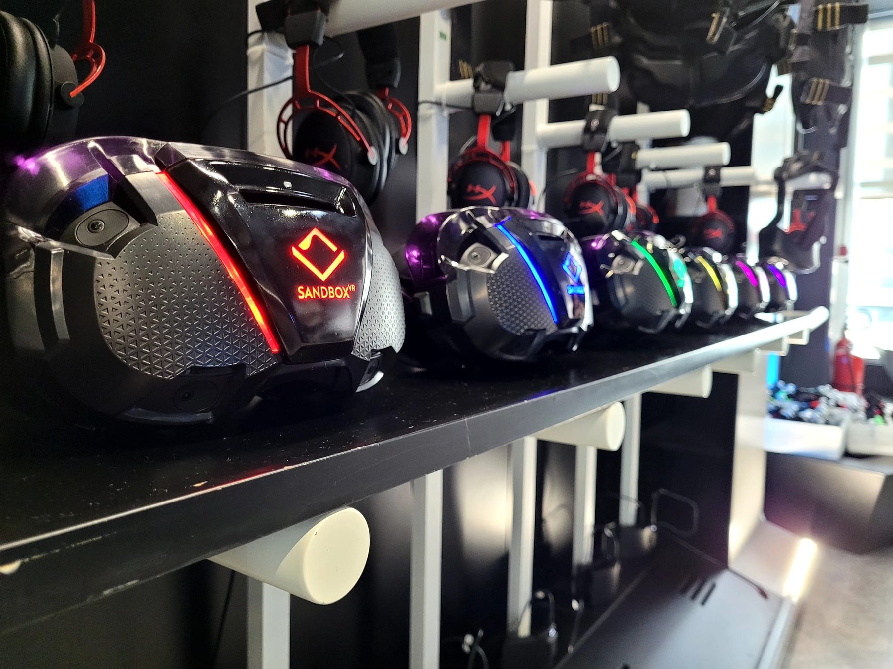 Head trackers charging on a store rack