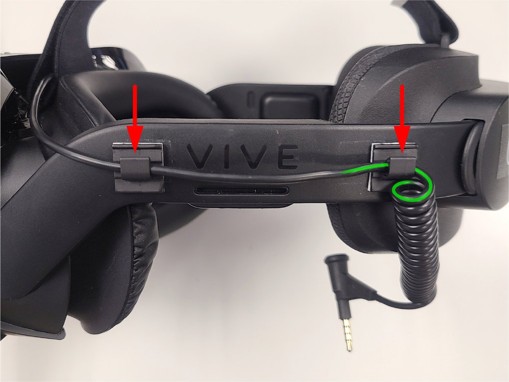 Audio cable routed along the headset strap