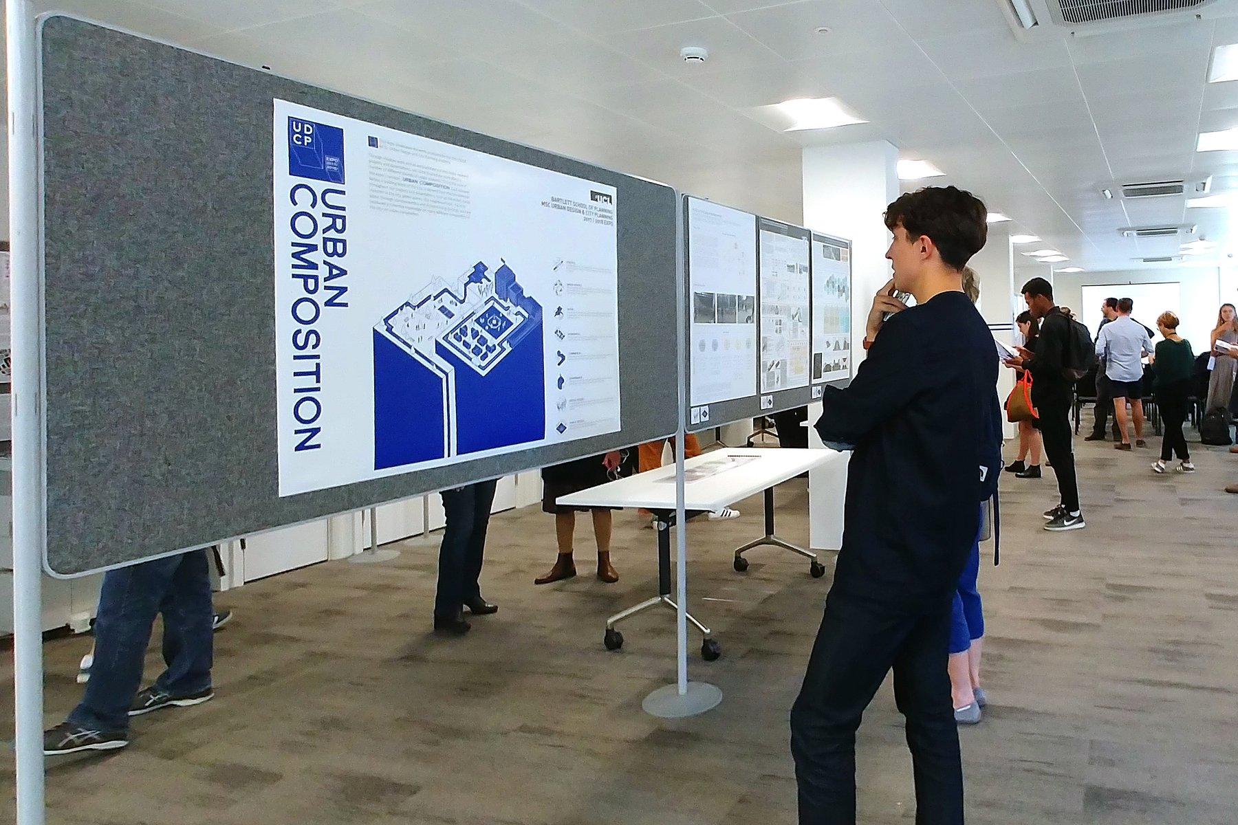 Visitors viewing the UCL exhibition